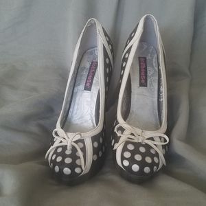 Black with white polka dot platform pumps.